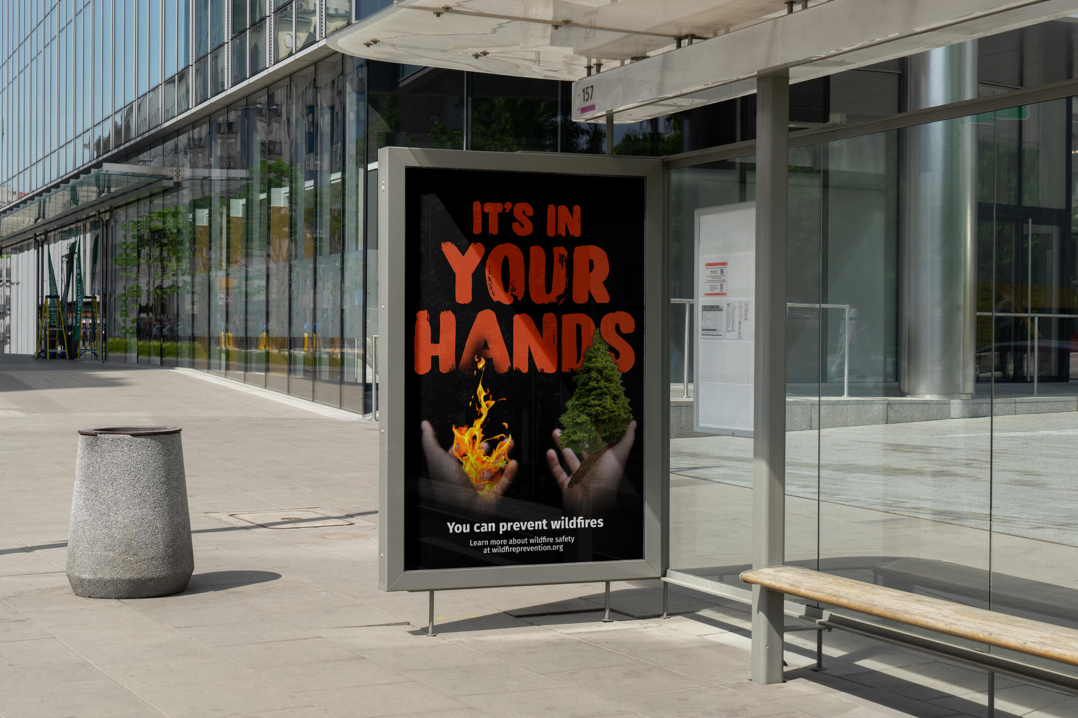 Mockup of a poster raising wildfire awareness. A hand on the left is holding a flame, while a hand on the right is holding a tree. (It's in your hands. You can prevent wildfires. Learn more about wildfire safety at wildfireprevention.org.)